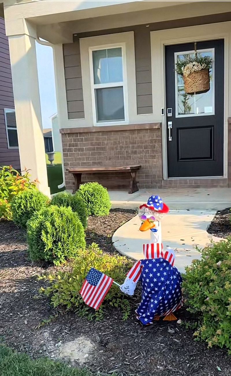 Lucy Goosey the porch goose wearing fourth of july